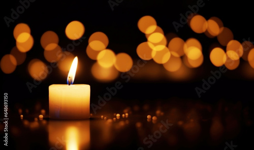 Burning candle on a black background