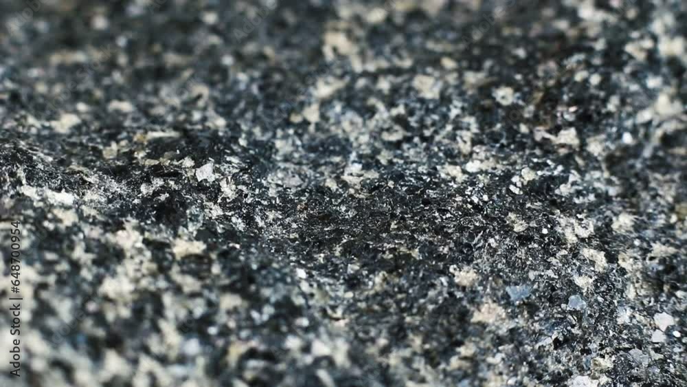 Macro close up of a hard rough granite rock texture Macro close up of a hard rough granite rock texture