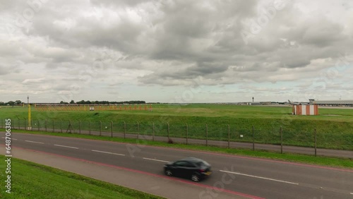 Aiport Timelapse with Planes taking off, main road foreground blurry timelapse. East Midlands Airport Runway 09