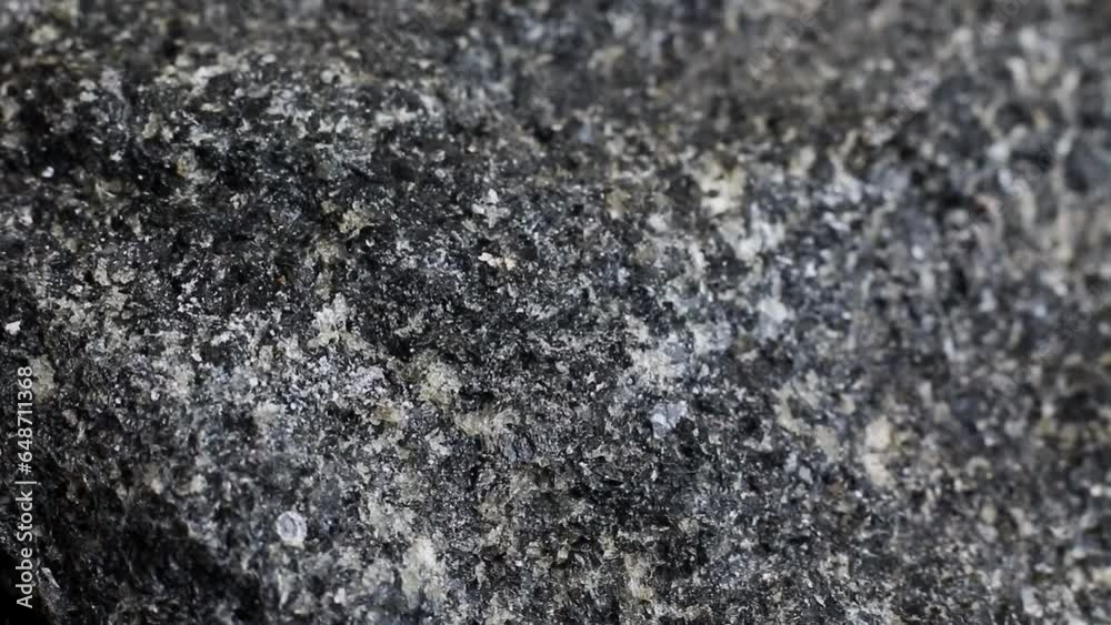 Macro close up of a hard rough granite rock texture Macro close up of a hard rough granite rock texture