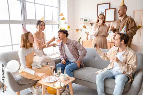 Group of young friends celebrating Birthday at home