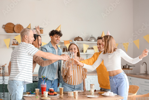 Group of young friends with...