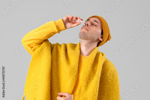 Ill young man with nasal dr...