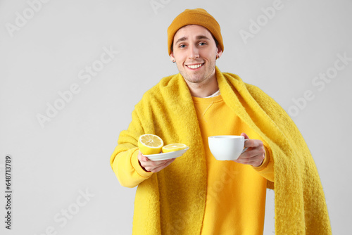 Ill young man with lemon an...