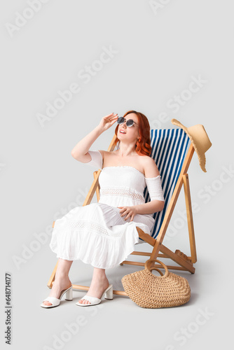 Young woman with sunglasses...