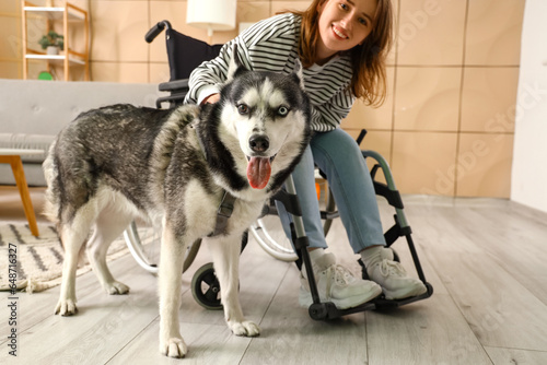 Young woman in wheelchair a...