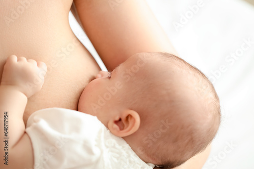 Newborn baby breastfeeding ...