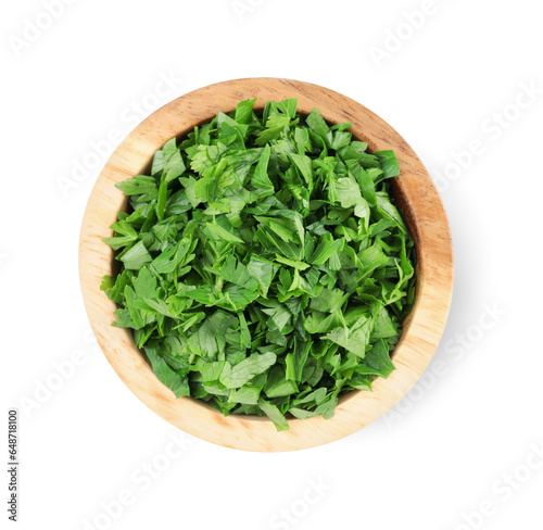 Chopped parsley leaves in wooden bowl isolated on white, top view