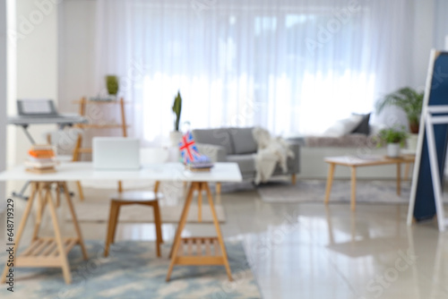 Blurred view of office with English teacher's workplace