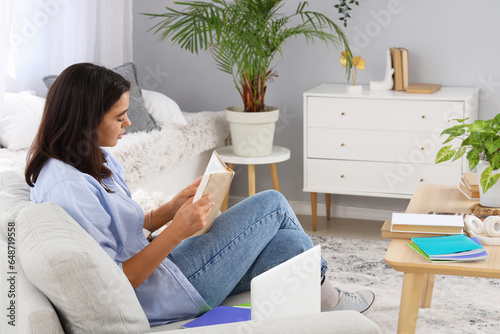 Young woman with book learn...