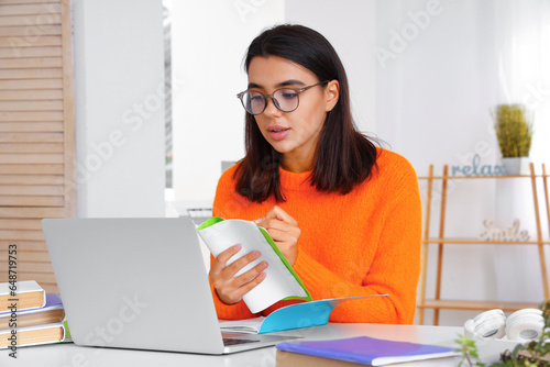 Young woman learning Englis...