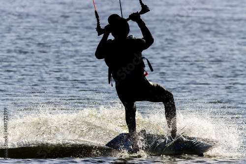 Grussai, RJ, Brazil, 08/19/2023 - Kitesurfer rides a board on a lagoon at Grussai Beach photo