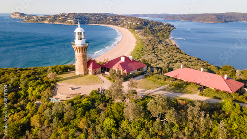 Aerial drone view of Barrenjoey Head Lighthouse at Barrenjoey Headland, Palm Beach, Northern Beaches in Sydney, New South Wales, Australia on a sunny morning   photo