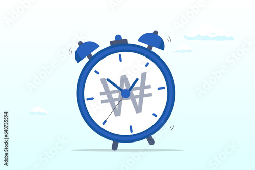 Ringing alarm clock with Won money sign on clock face, time for money, making profit from investment, promotion alert for bargain deal, bill payment or deadline to start building wealth (Vector)