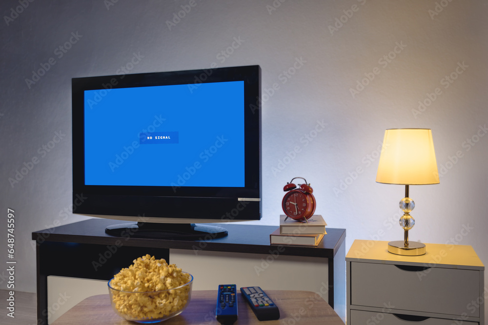4K LCD television with blue screen no signal, on in the living