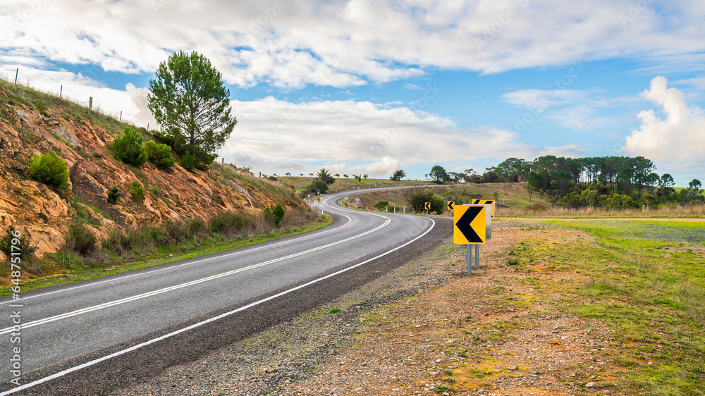 Winding road through Adelaide Hills during winter season, South Australia - obrazy, fototapety, plakaty 