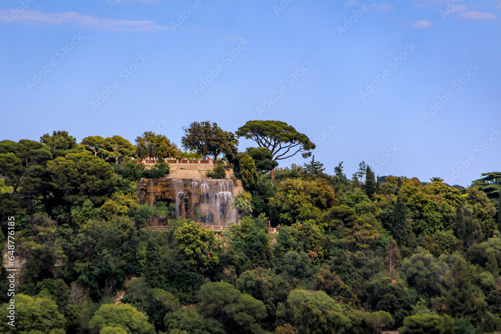 Cascading waterfall atop Castle Hill or Colline du Chateau at the park in Nice, tourist landmark of French Riviera, South of France