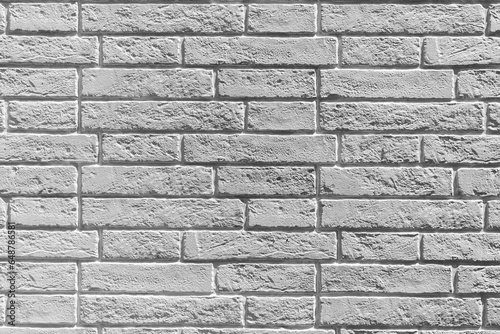 Gray brick wall, front view. Backgrounds.