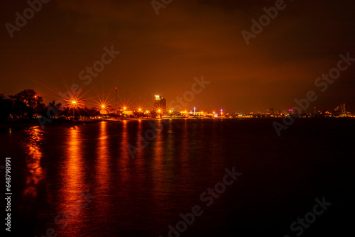 The background of the sea by the evening sea  with natural beauty  sea water  rocks  sky  and fishermen are fishing by the river bank  is a pleasure during travel.