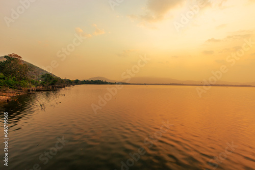 The background of the sea by the evening sea, with natural beauty (sea water, rocks, sky) and fishermen are fishing by the river bank, is a pleasure during travel. photo