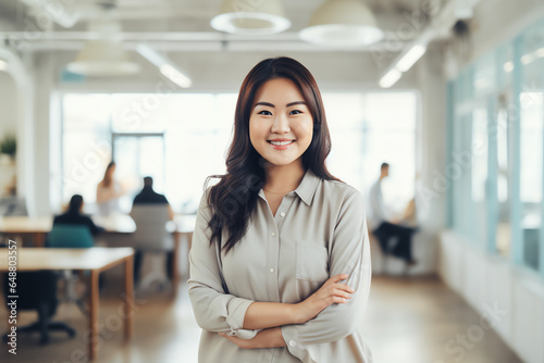 Attractive asian businesswoman CEO confident and staning front of modern office