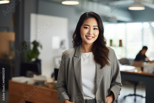 Attractive asian businesswoman CEO confident and staning front of modern office