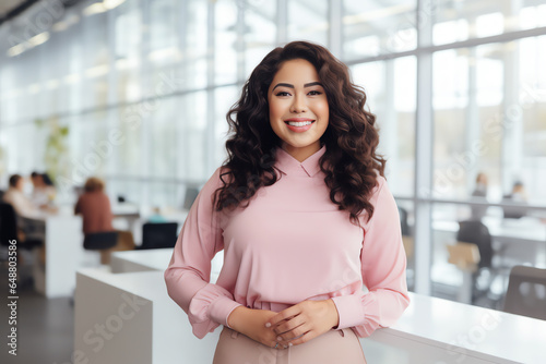 Attractive hispanic businesswoman CEO confident and staning front of modern office photo