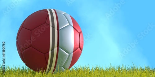 Football ball textured by Colorado Rapids american soccer team uniform colors. Green grass of football field. 3D render