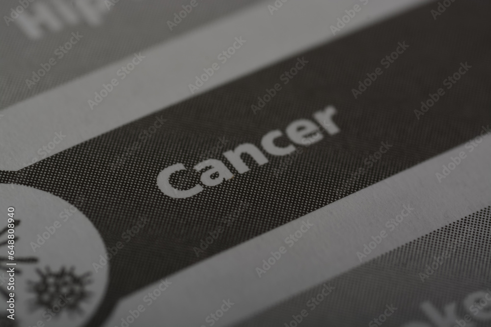 Close up view of the word CANCER. Cancer is a group of diseases characterized by the uncontrolled growth and spread of abnormal cells in the body. Close up view of the word CANCER. Cancer is a group of diseases characterized by the uncontrolled growth and spread of abnormal cells in the body.