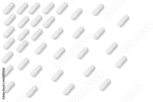 white matte pills or tablets stand in rows on an isolated background