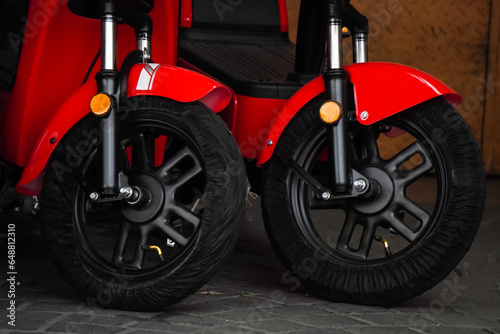 Brand new electric scooter motorbikes tires or wheels are for sale to customers. Electric motorbike shop. Concept for renewable energy  global warming.