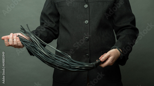 Tableau sur toile male dominant holds a leather whip Flogger for hard BDSM sex with spanking