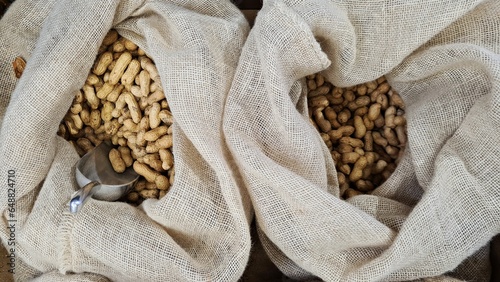 Peanuts healthy nuts are poured into bags for sale at the market