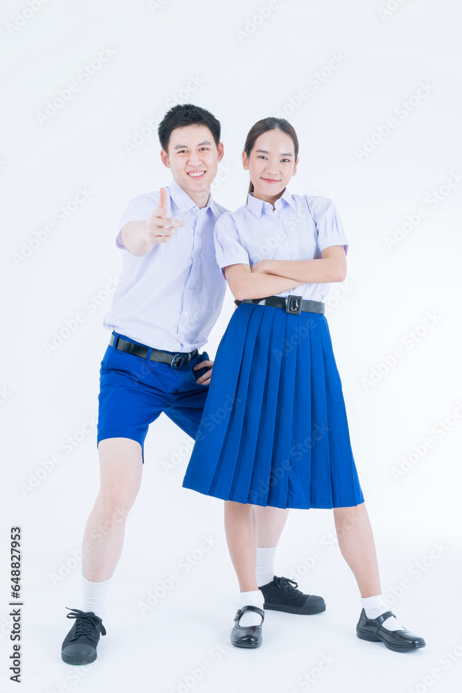 Thai student Uniform. Two Asian students standing together. Asian young couple in students uniform on white background. Thai student Uniform. Two Asian students standing together. Asian young couple in students uniform on white background.