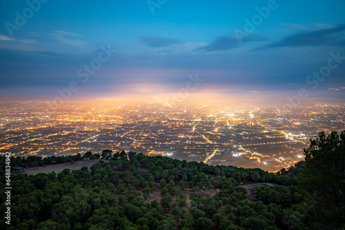 Panoramic view of the orchard of Murcia, Spain, with the city as the protagonist at dawn from the Cresta del Gallo