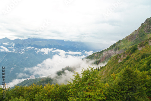 Beautiful view from the heights of mountains with clouds.