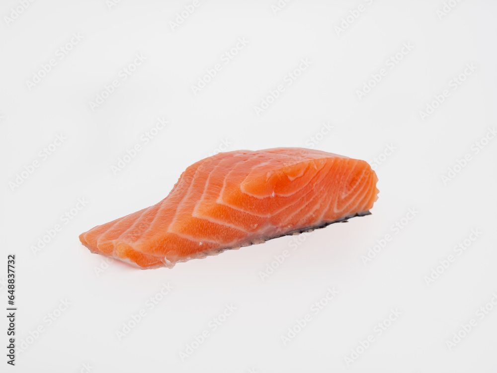 Salmon fish fillet on a white background. Red fish fillet close-up.