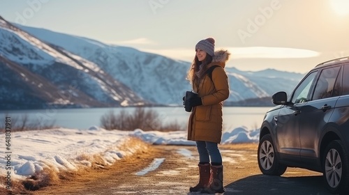 Lady travel investigating getting a charge out of the see of the mountains scene way of life concept winter excursion outside Female with portable phone standing close the car in sunny day