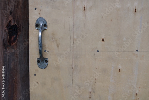 Door handle.Door handle one old wood with rusty nail marks.