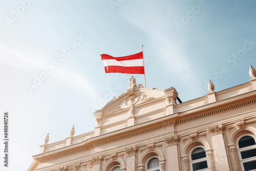 Austrian National Day. Austrian Flag Waving On Top Of A Building Against Blue Sky. Ai Generated