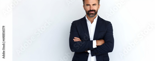 Panoramic portrait of a handsome positive caucasian successful business man in a suit, seo, banker, broker, stand on isolated white background with arms crossed, looks at camera, smiling, Copy-space