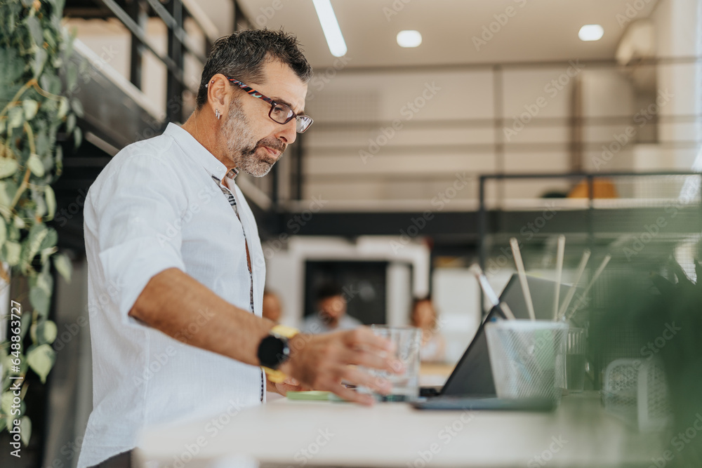 Fototapeta premium Businessman Gathering Information for Business Strategy in a Multiracial Company