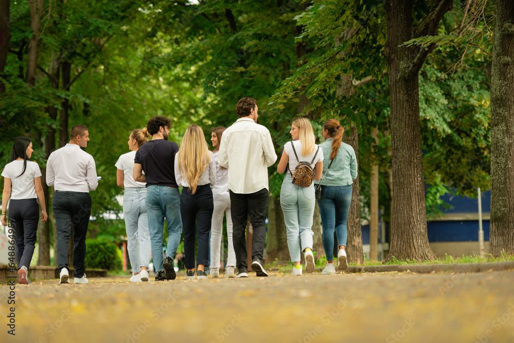 Big group of young students going back to school