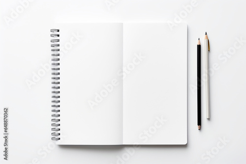 Blank notebook and pencil on white background. View from above. © Aonsnoopy