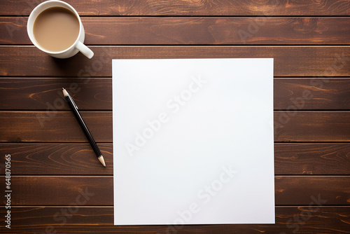 Blank paper with pen and cup of coffee on wooden table background
