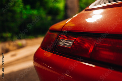 Old red supercar taillight lamp on detailing and restoration photo