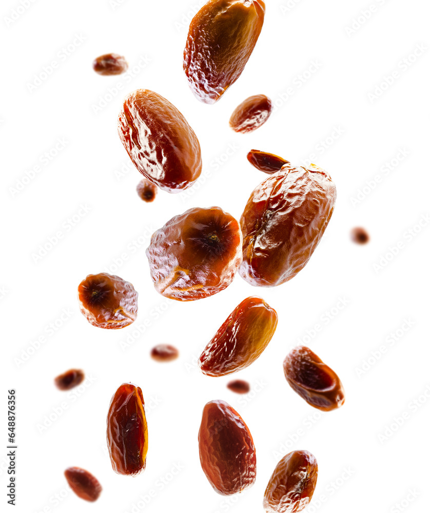 Dates fly and levitate in space. Volumetric light from behind. Selective focus. Isolated on white Dates fly and levitate in space. Volumetric light from behind. Selective focus. Isolated on white