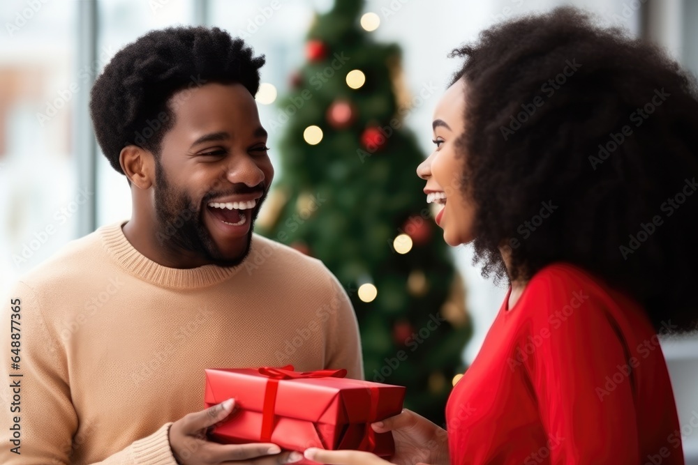 a man surprising his girlfriend with Christnas gift box a man surprising his girlfriend with Christnas gift box