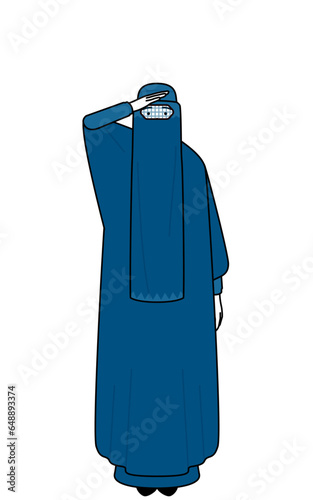 Muslim woman in burqa looking into the distance