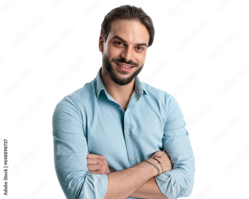 attractive young guy with beard in denim shirt crossing arms and smiling attractive young guy with beard in denim shirt crossing arms and smiling